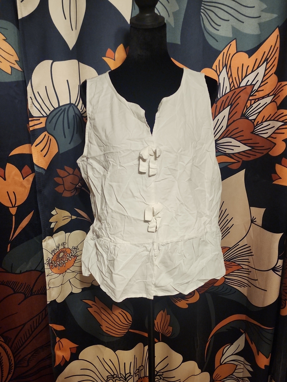 Sleeveless White Tie-Front Peplum Blouse